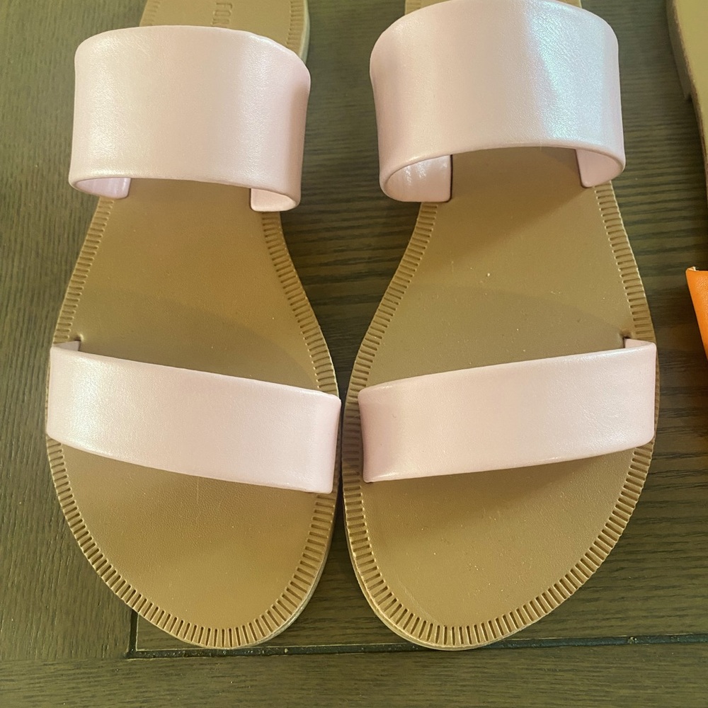 Women’s slides size 6. Pink pair has 2 straps and orange has 1 wide piece.